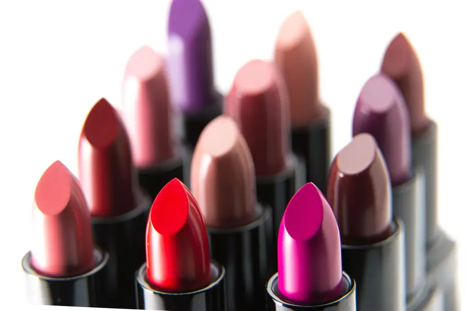 Close-up of unbranded lipsticks in red, pink, nude and plum shades standing together